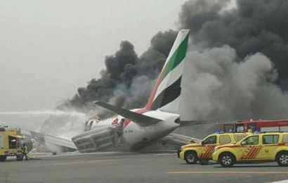 Firefighter dies as Emirates plane with 300 passengers crash-land at Dubai airport